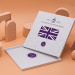 An open, empty square presentation box with a printed pattern commemorating the Platinum Jubilee
