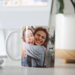 A mug with a photo of two people hugging